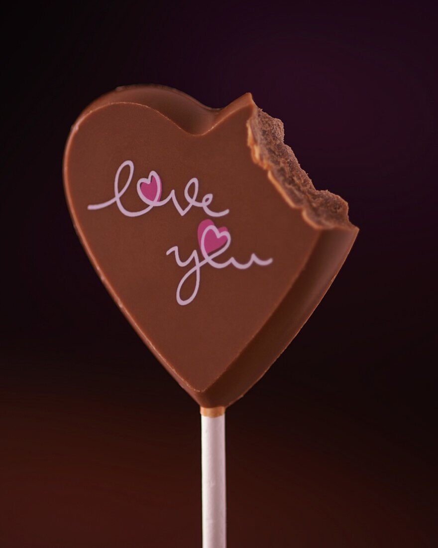 A chocolate heart with a bite missing