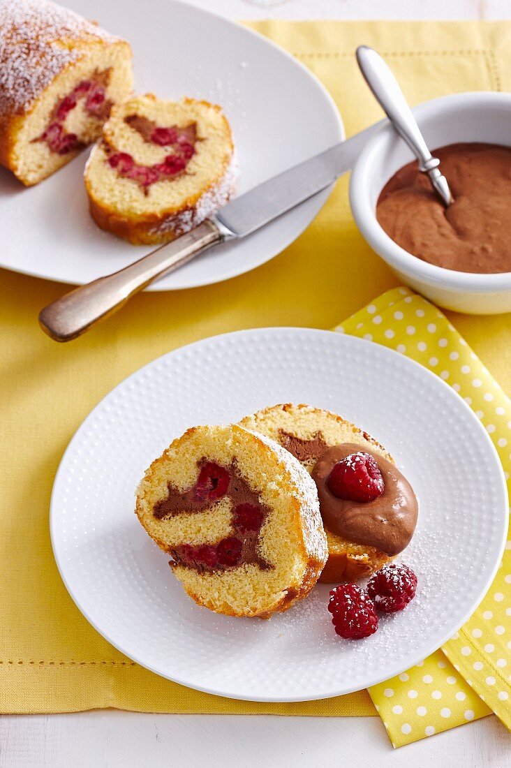 Sponge roll with chocolate mousse and raspberries