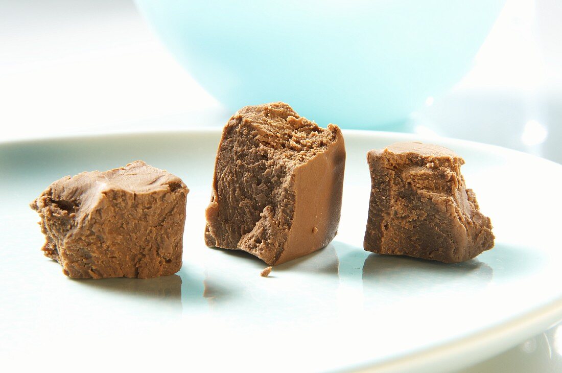 Three cubes of nougat on a plate