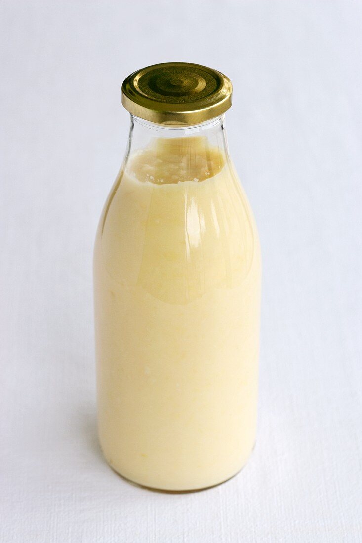 White asparagus soup in a bottle