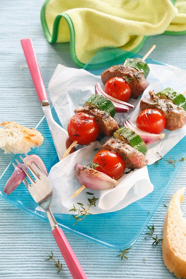 Skewers of lamb with courgette and cherry tomatoes