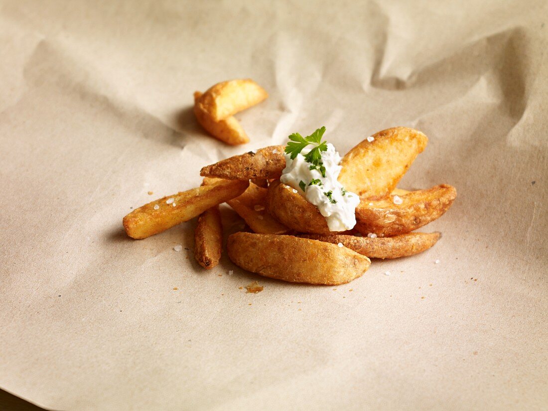 Potato wedges topped with herb dip