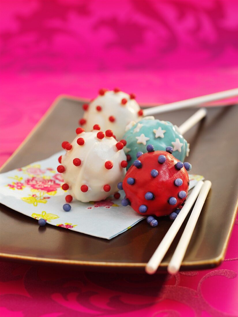 White, red and blue cake pops with stars and balls