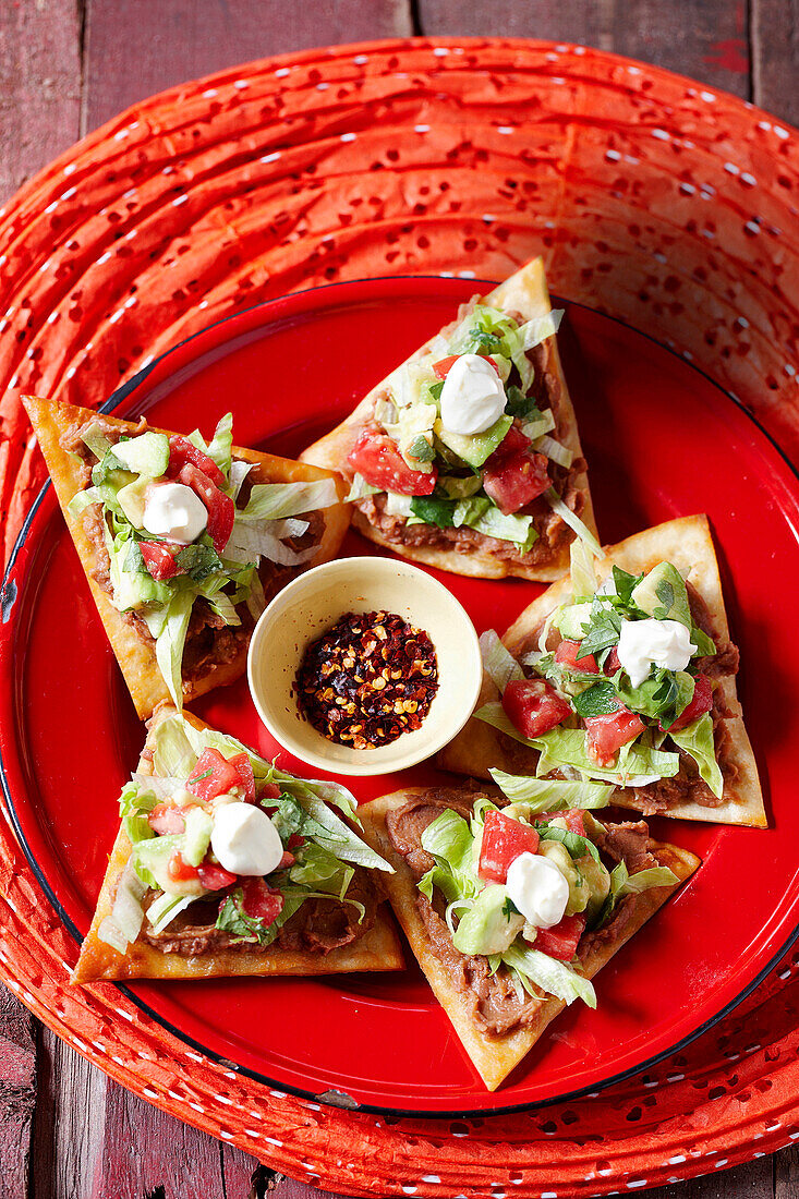 Tostaditos with beans and avocado