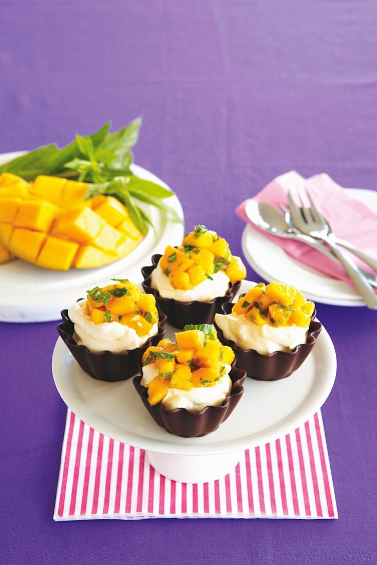 Chocolate baskets filled with mango and mint cream topped with mango salsa