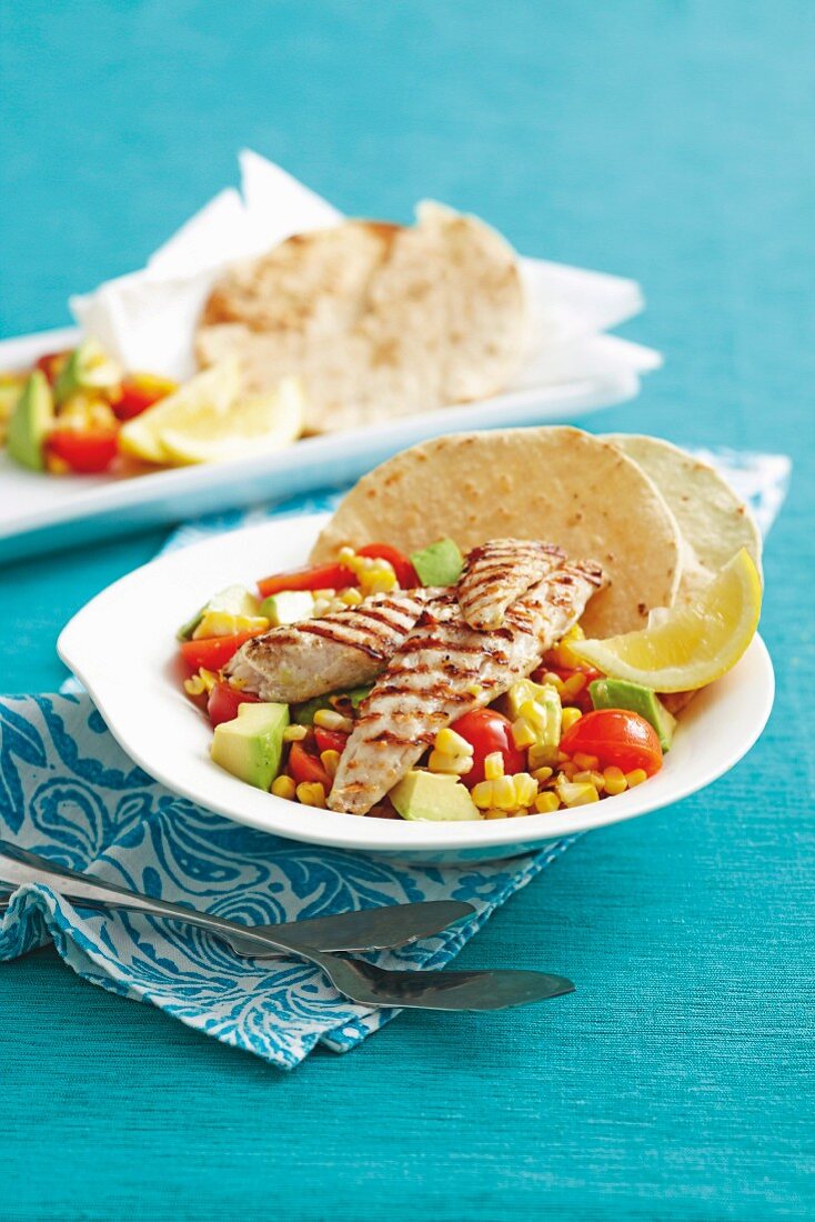 Grilled fish with sweetcorn salad and tortillas