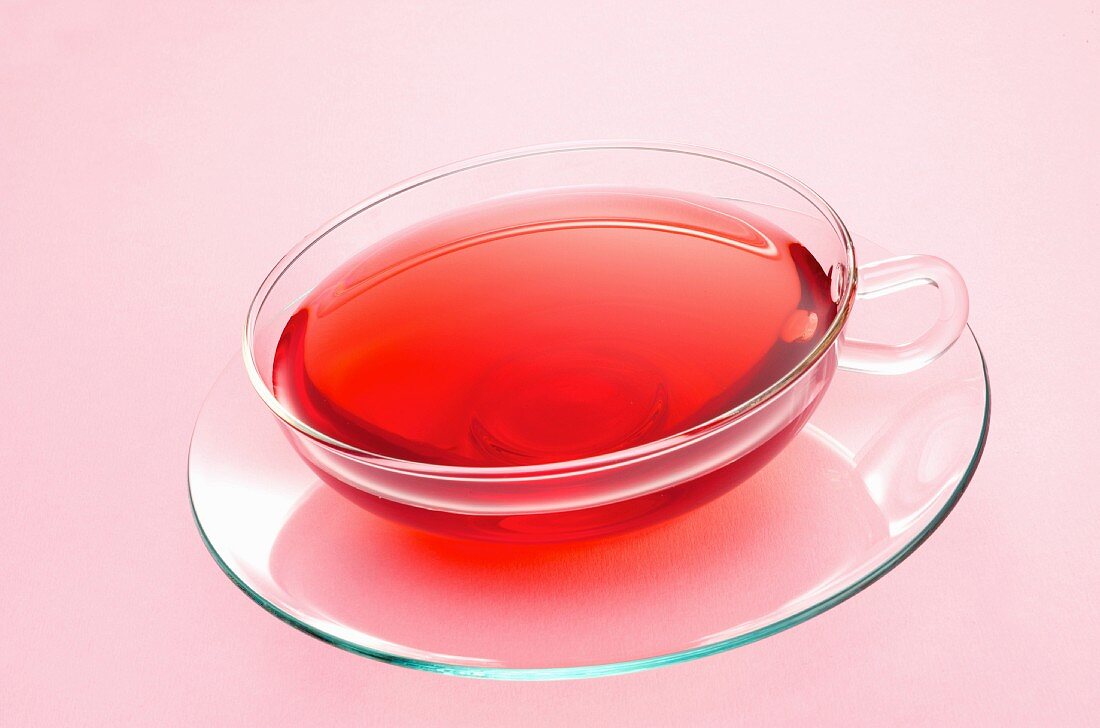 A glass teacup of fruit tea