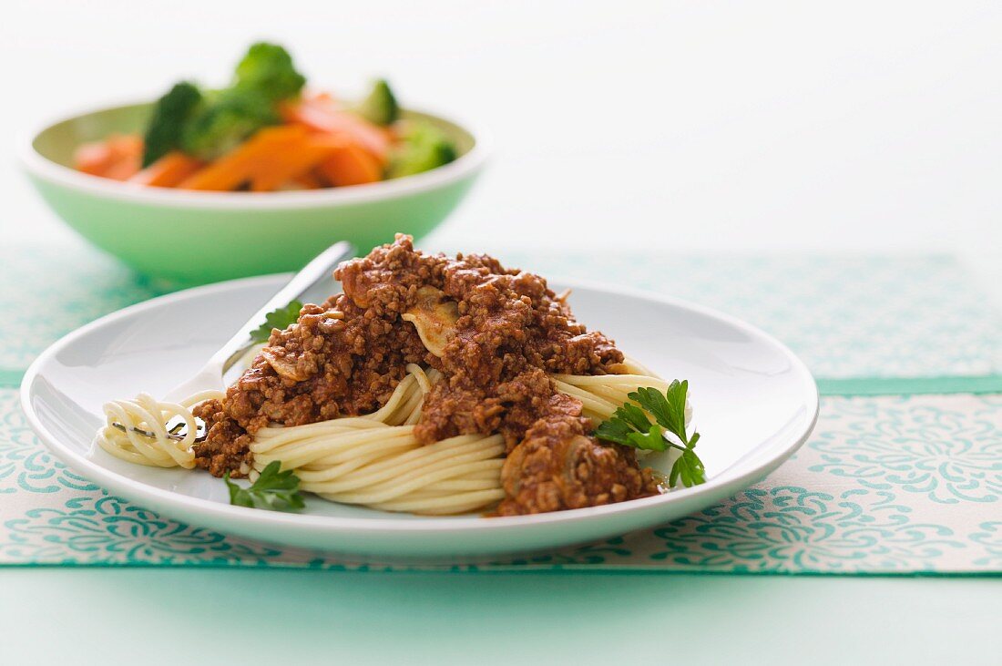 Spaghetti bolognese with salad