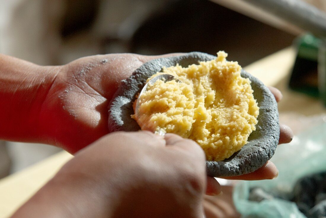 Tlacoyo (oval corn tortilla, Mexico) with chickpea purée