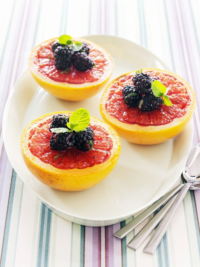 Pink Grapefruit Halves with Blackberries and Mint