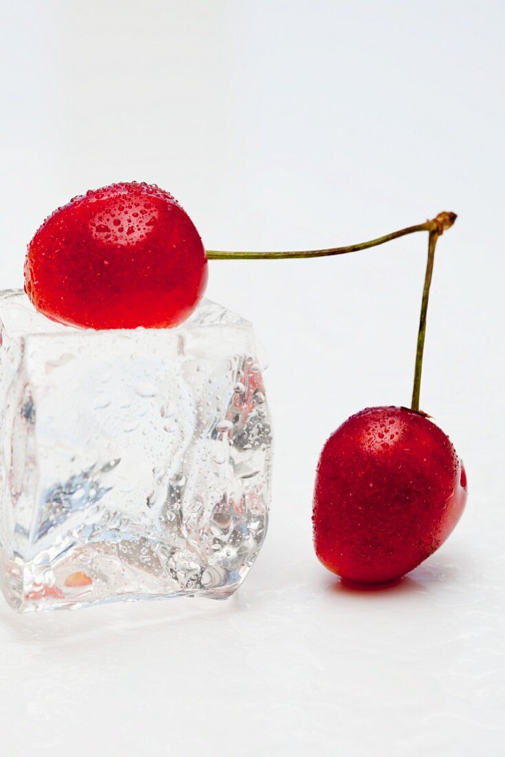 Red cherries with an ice cube