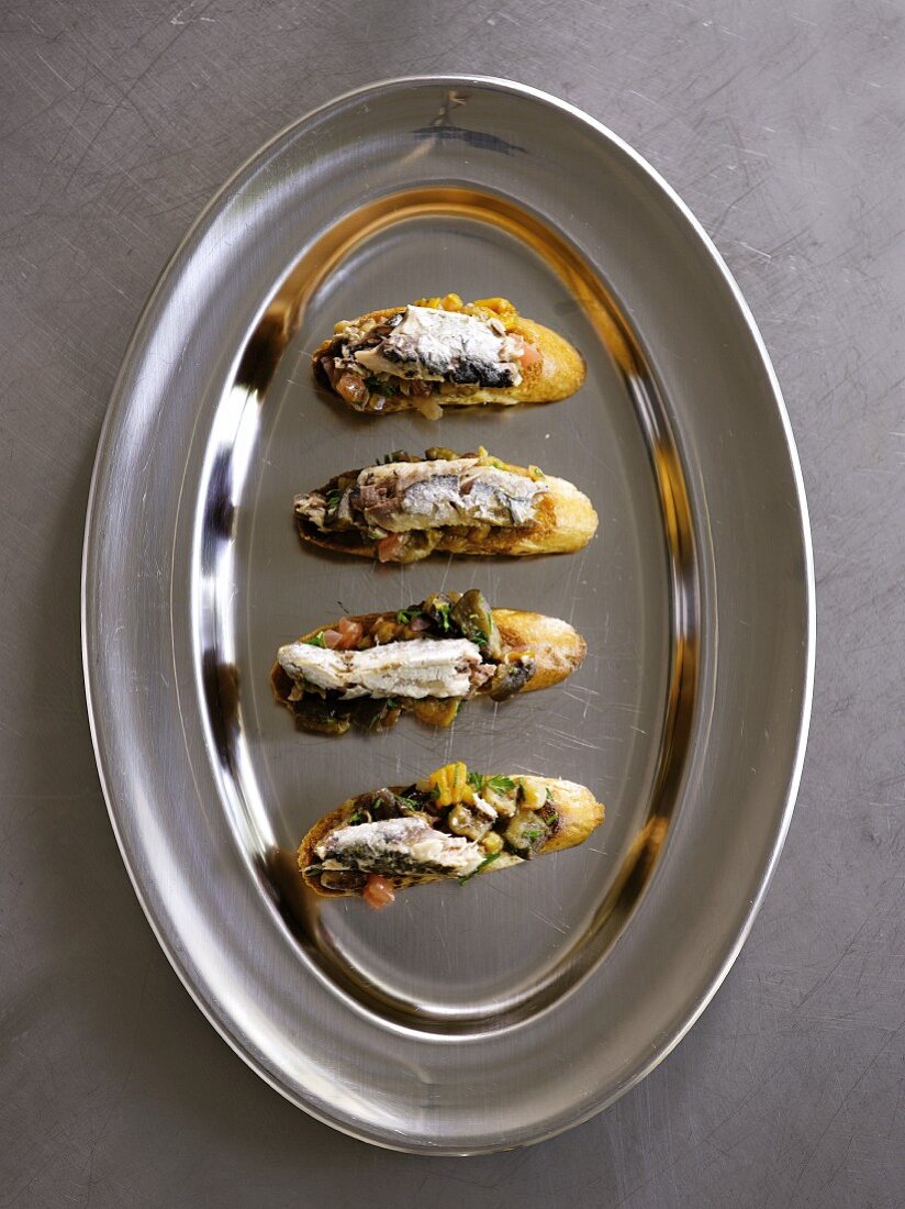 Crostini topped with herring fillets