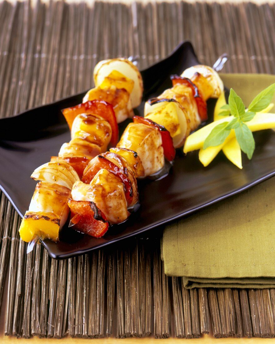 Chicken and Vegetable Skewers on a Square Plate