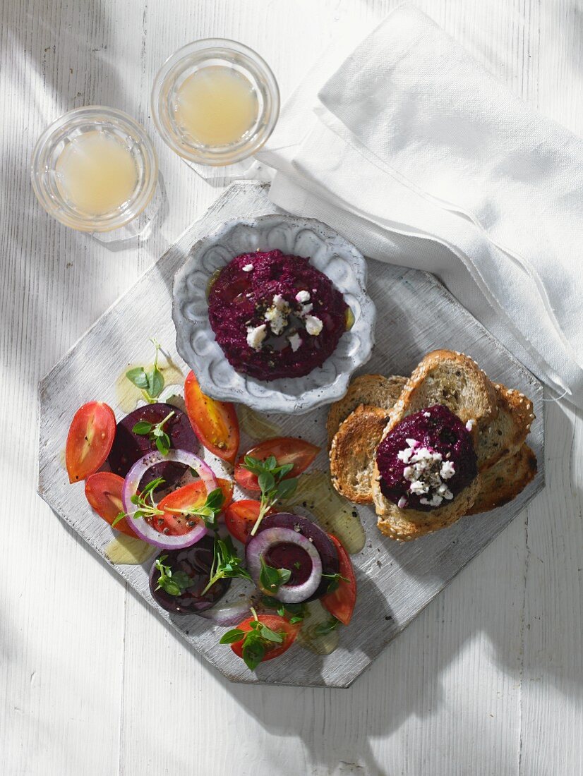 Beetroot dip with tomato salad and bread