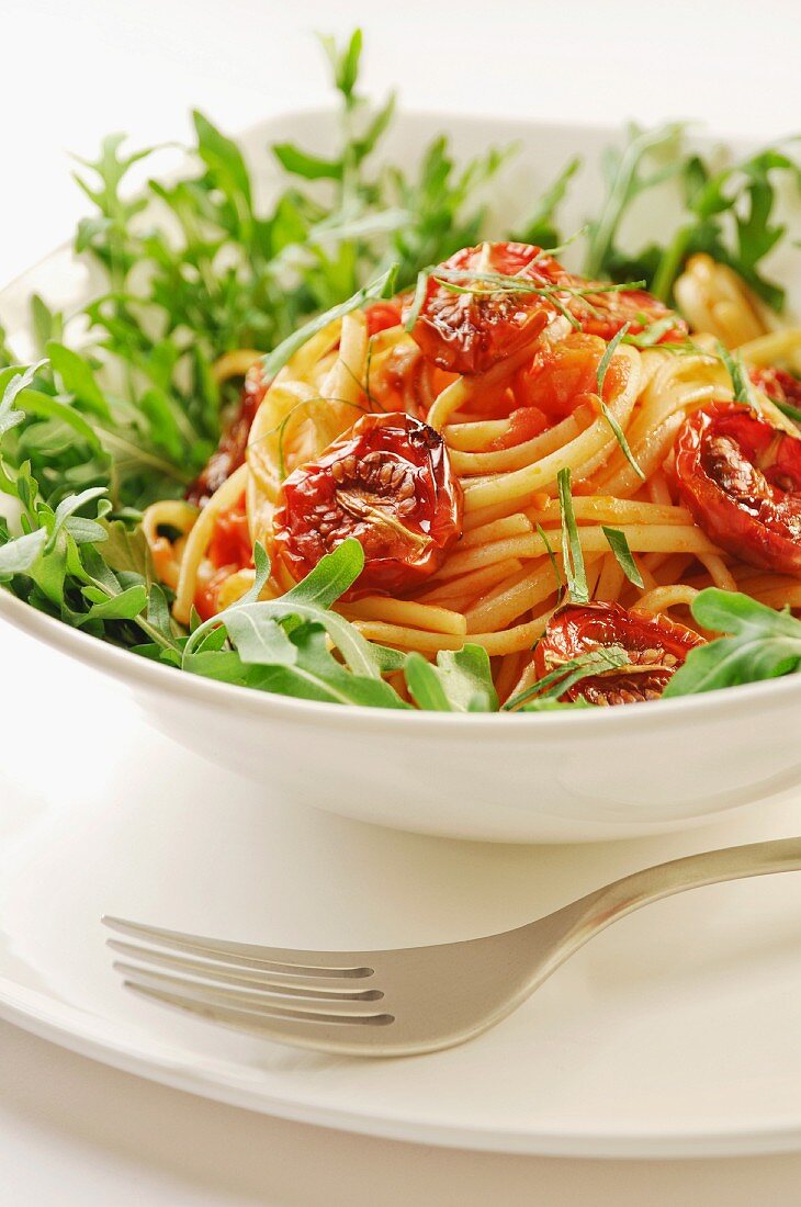 Delicious fresh pasta with balsamico marinated and dried tomatoes