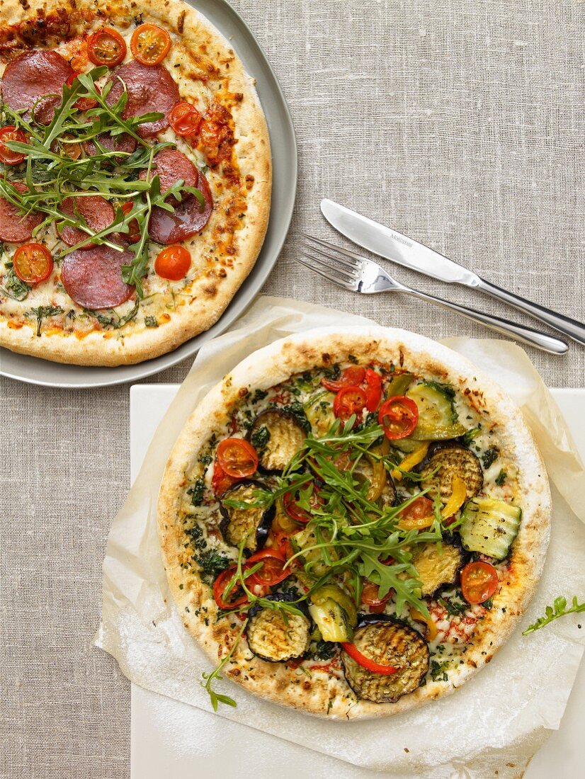Vegetable pizza and pepperoni pizza