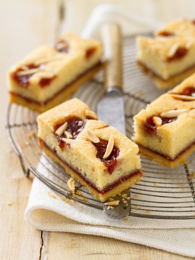 Raspberry and almond slices on a cooling rack