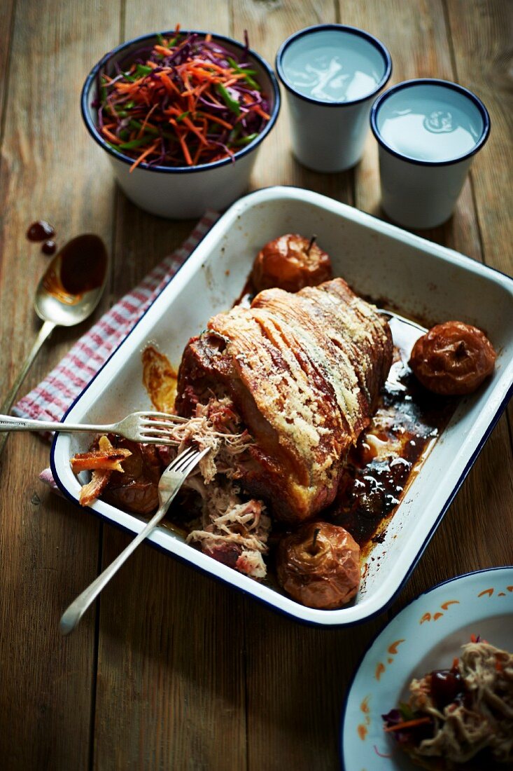 Roast pork wrapped in bacon, with apples