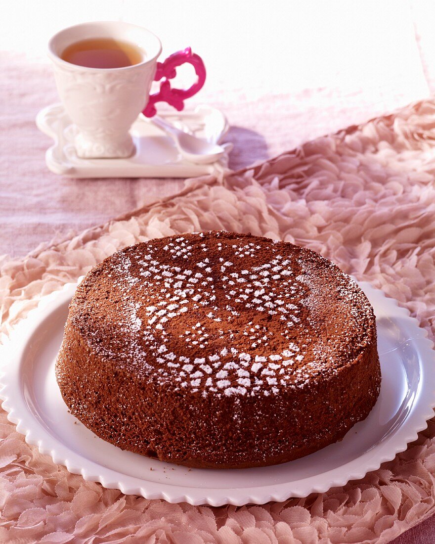 Celebratory chocolate cake dusted with icing sugar