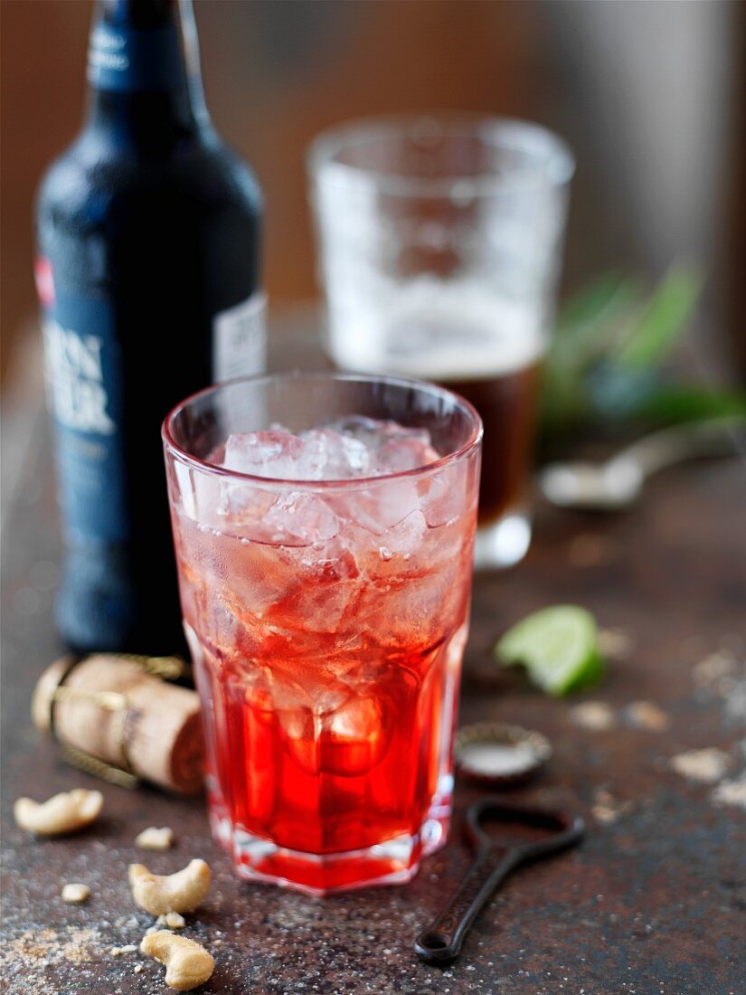 A red cocktail over ice