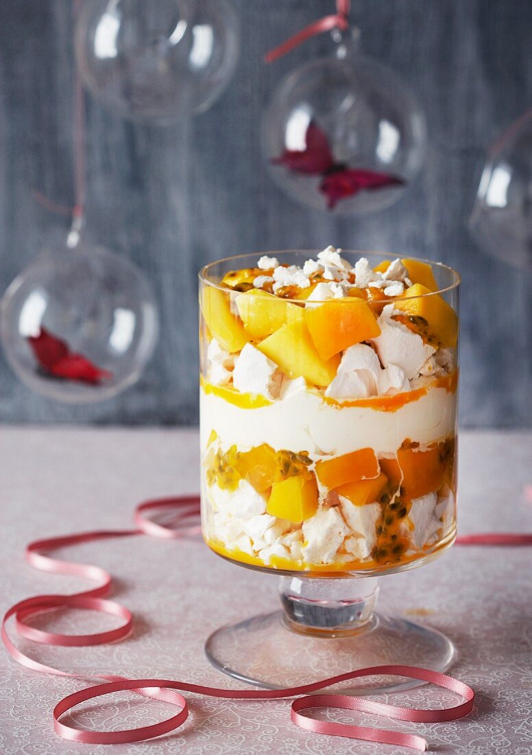 A trifle made with passion fruit, mango, meringue and custard cream