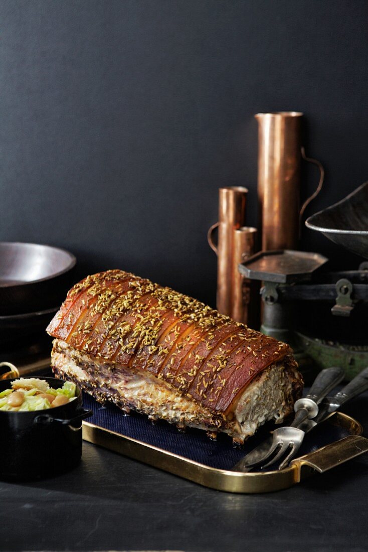 Roast pork with a fennel crust and white cabbage