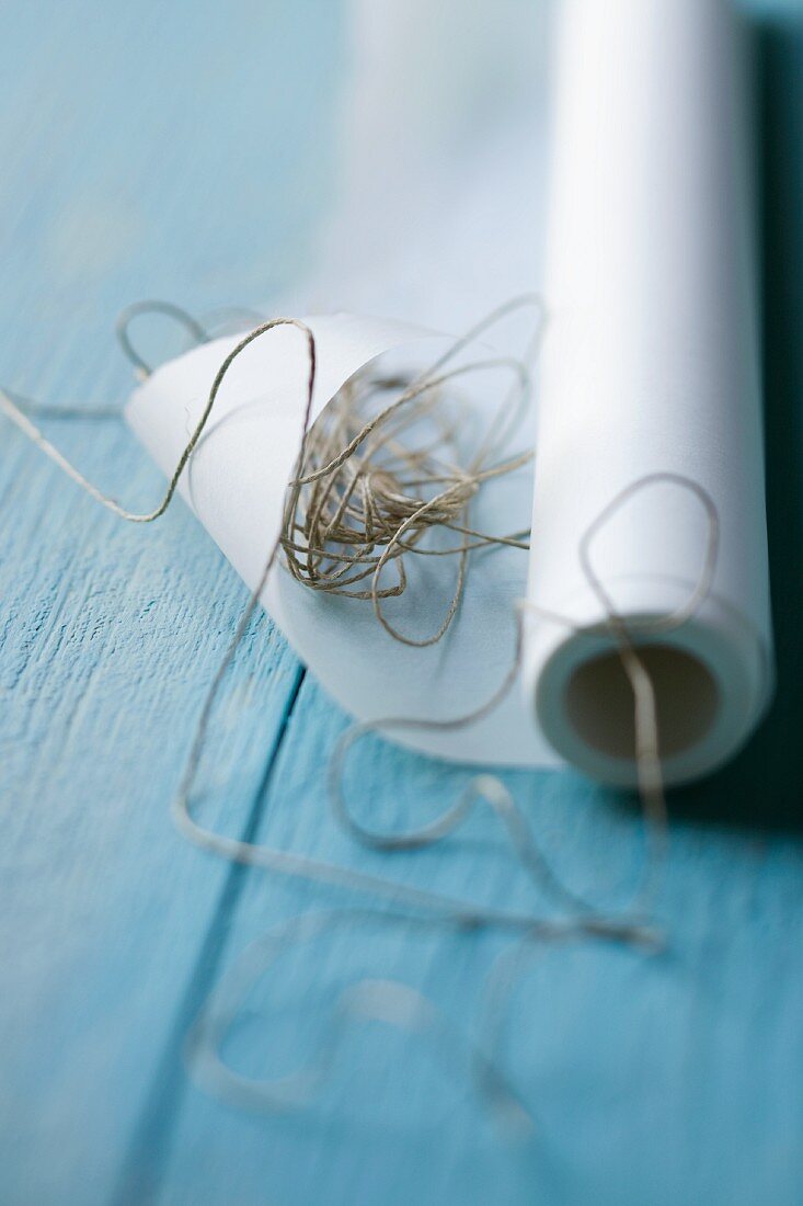 A roll of baking paper with string