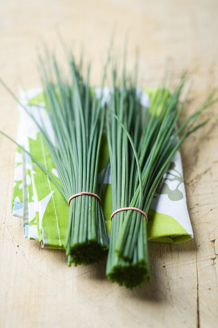 Two bunches of chives on a cloth