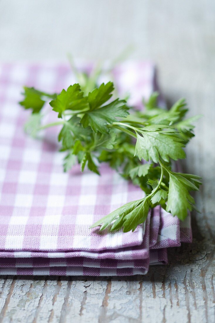 Flat-leaf parsley on a checked cloth