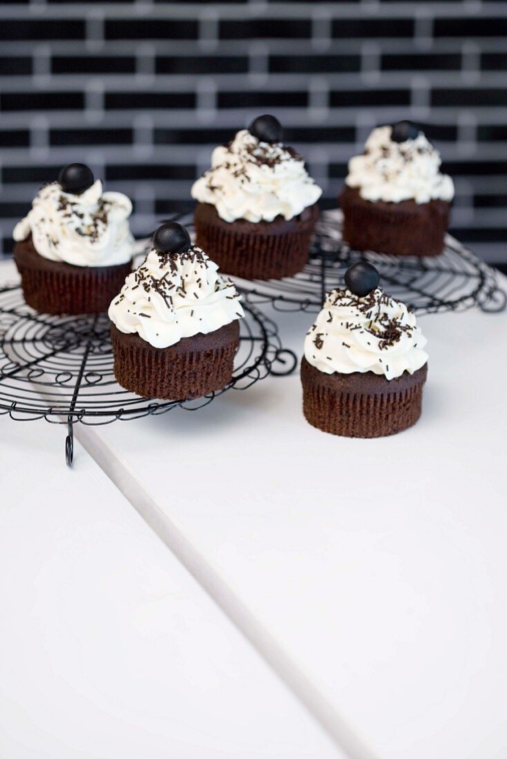 Black cupcakes topped with white cream