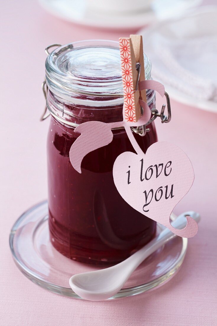 A jar of jam with an 'I love you' label