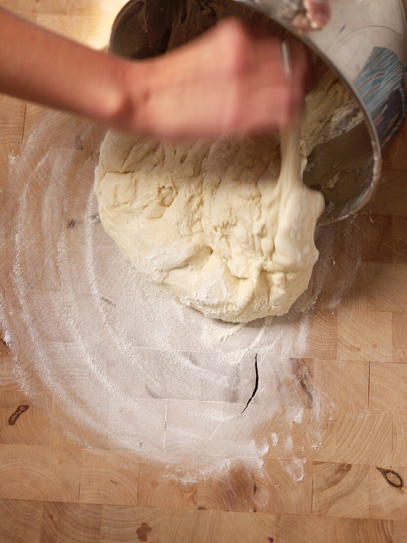 Making Bread; Dumping Dough from Pan onto Floured Surface