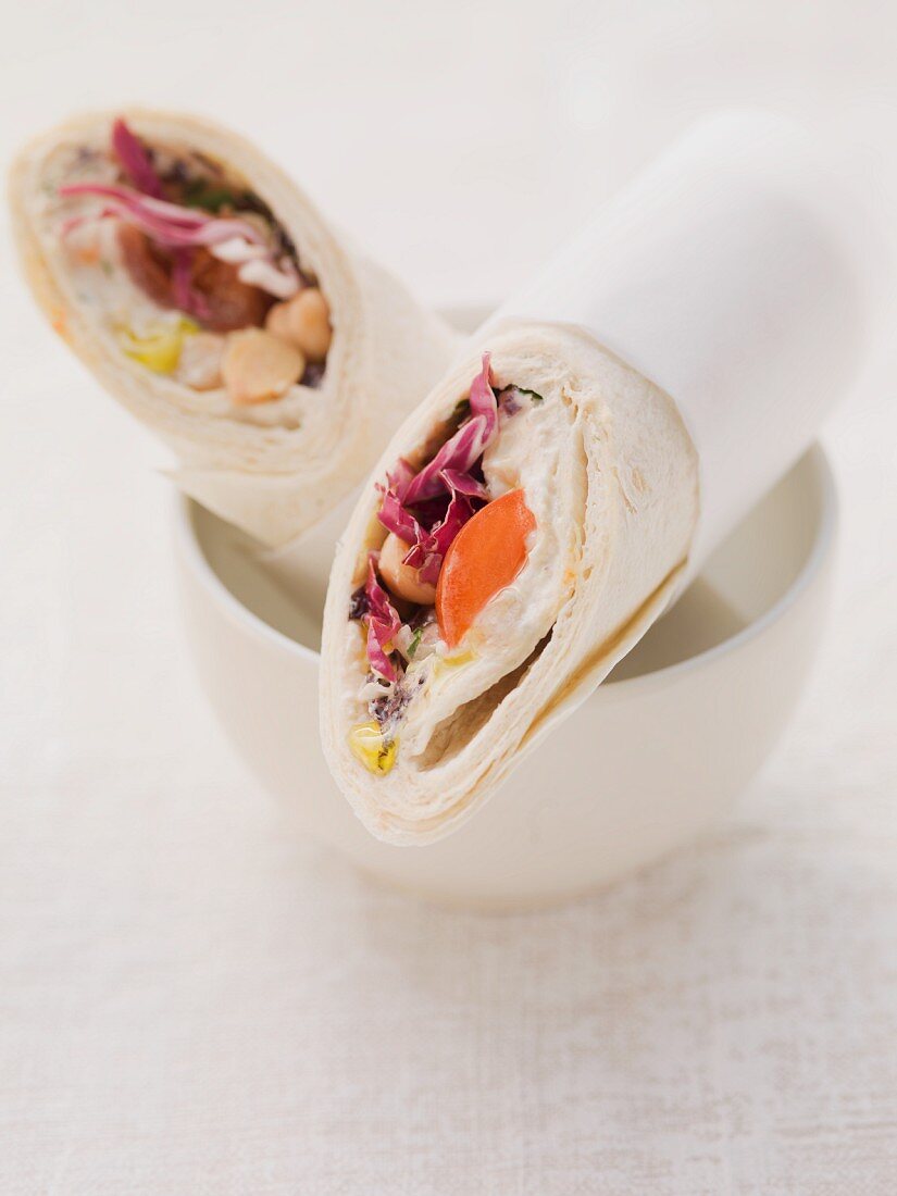 Wraps filled with houmous and tomatoes