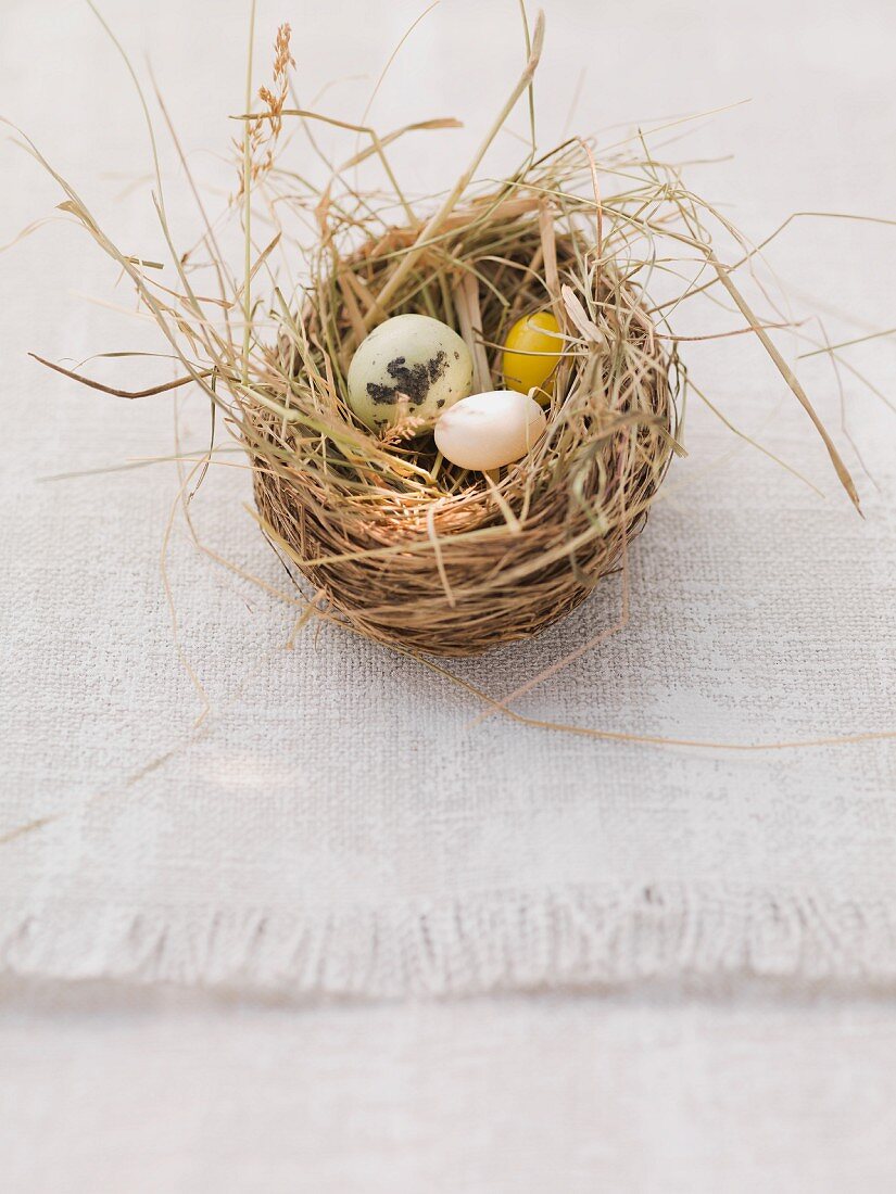 An Easter nest with marzipan and sugar eggs
