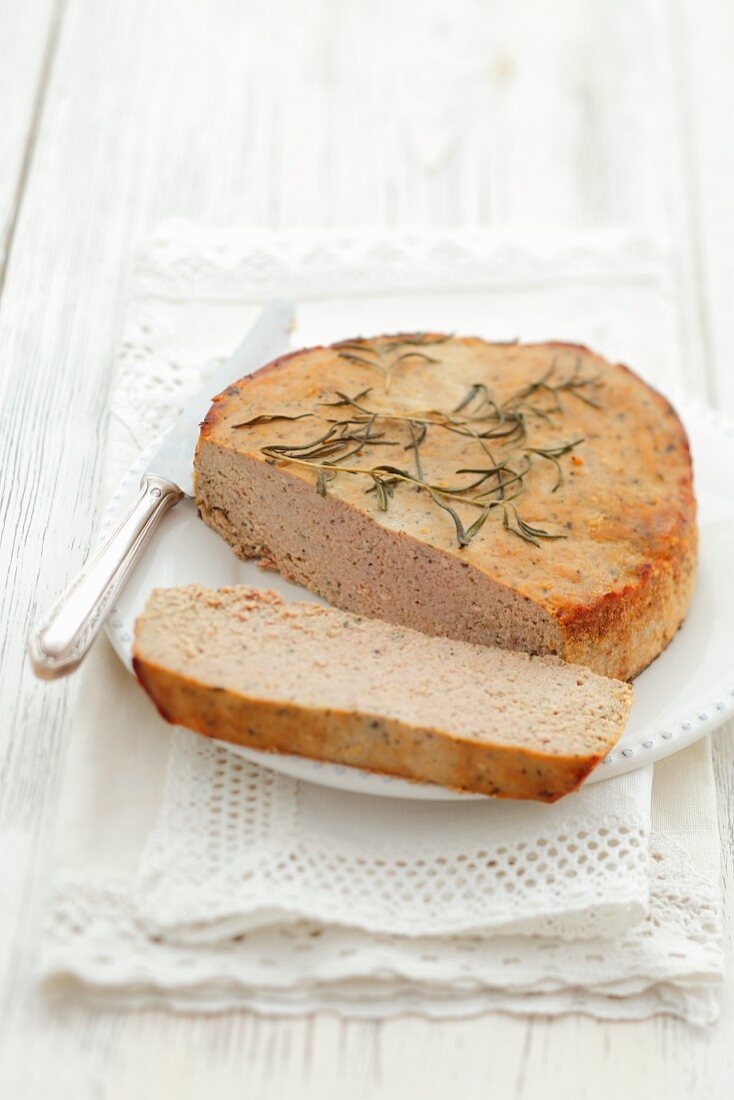Veal pâté with rosemary, partly sliced