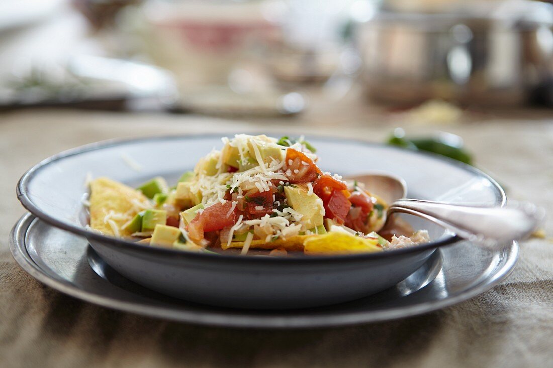 Chicken soup with vegetables and tortilla chips