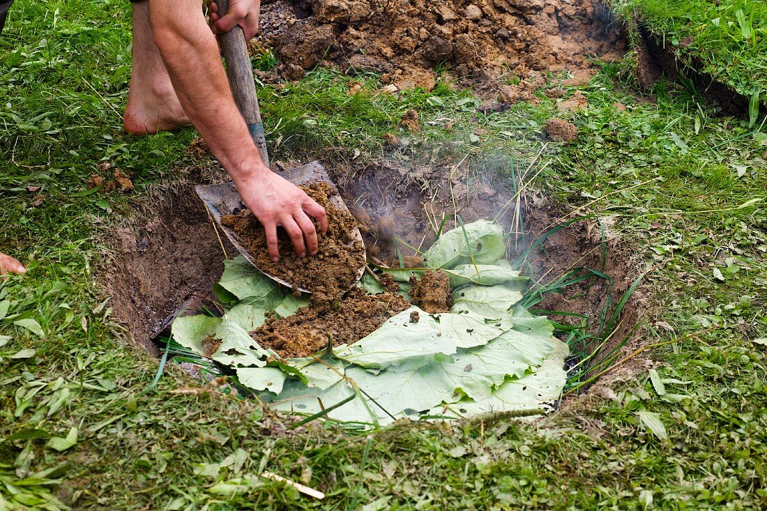 Cooking in a pit in the ground
