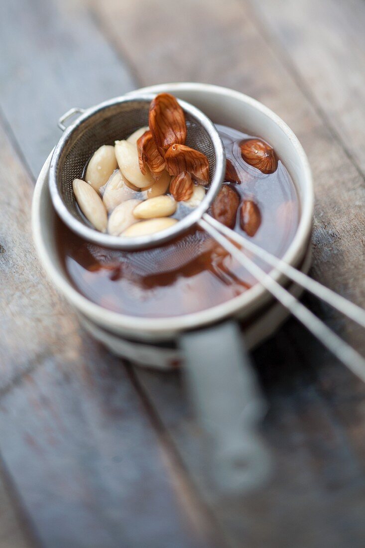 Almonds being skinned