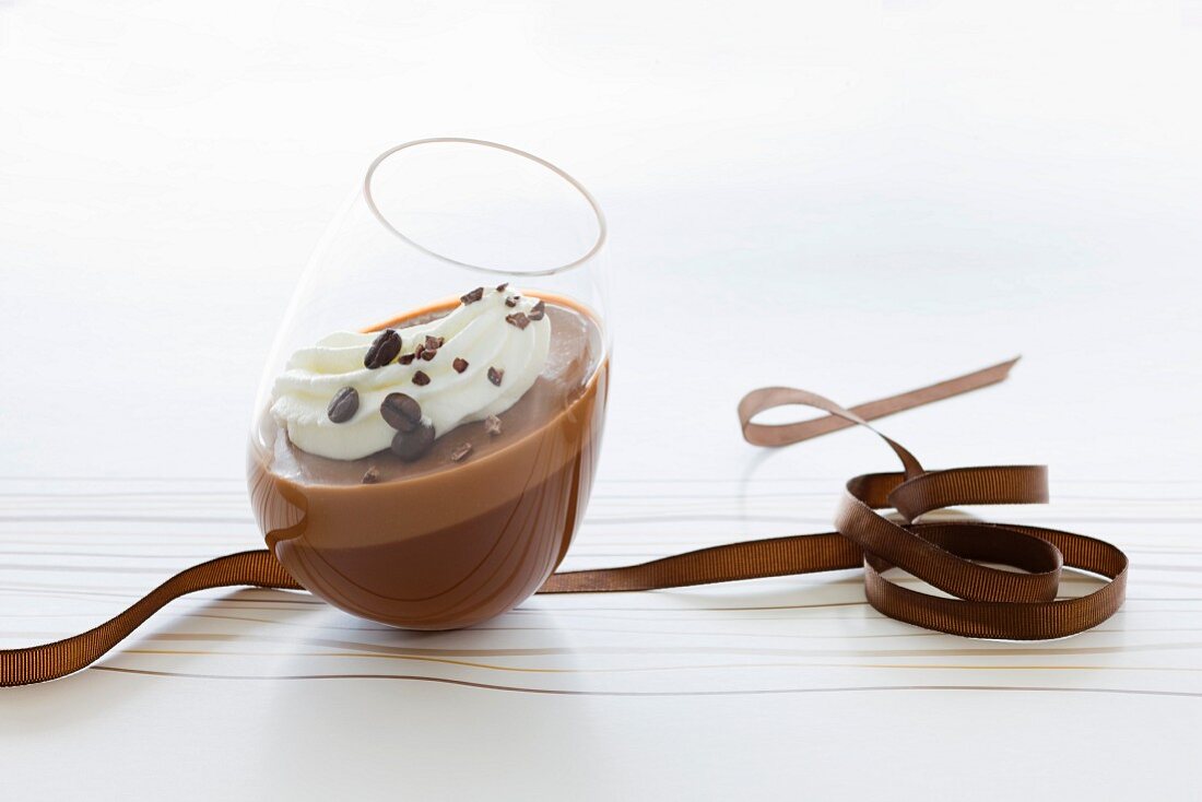 Chocolate mousse with cream and mocha beans