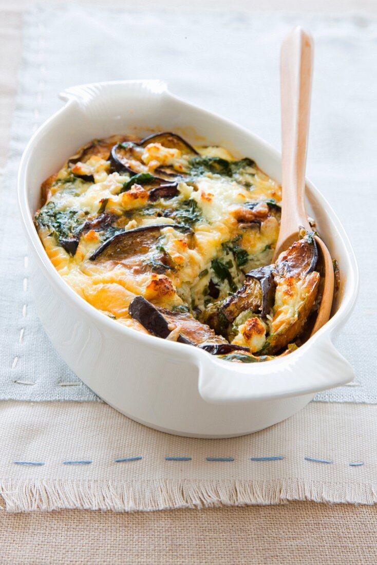 Aubergine and spinach bake in a casserole dish