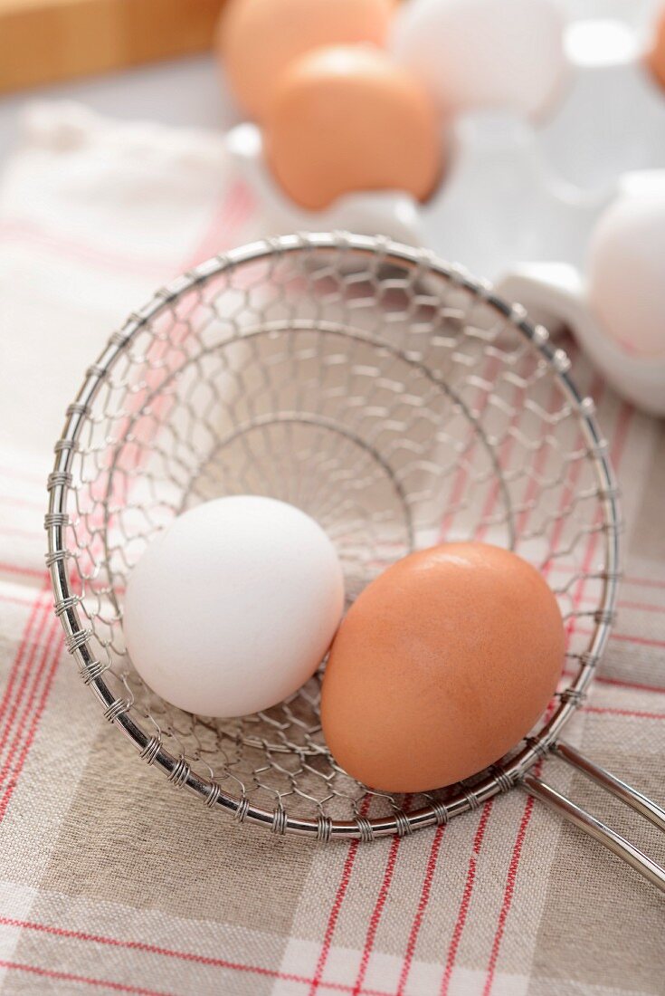 Boiled eggs in a draining spoon