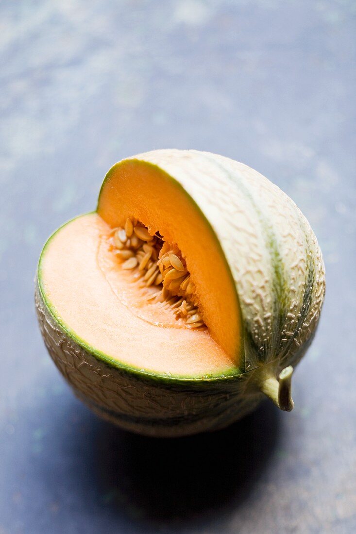 A cantaloupe melon, sliced open
