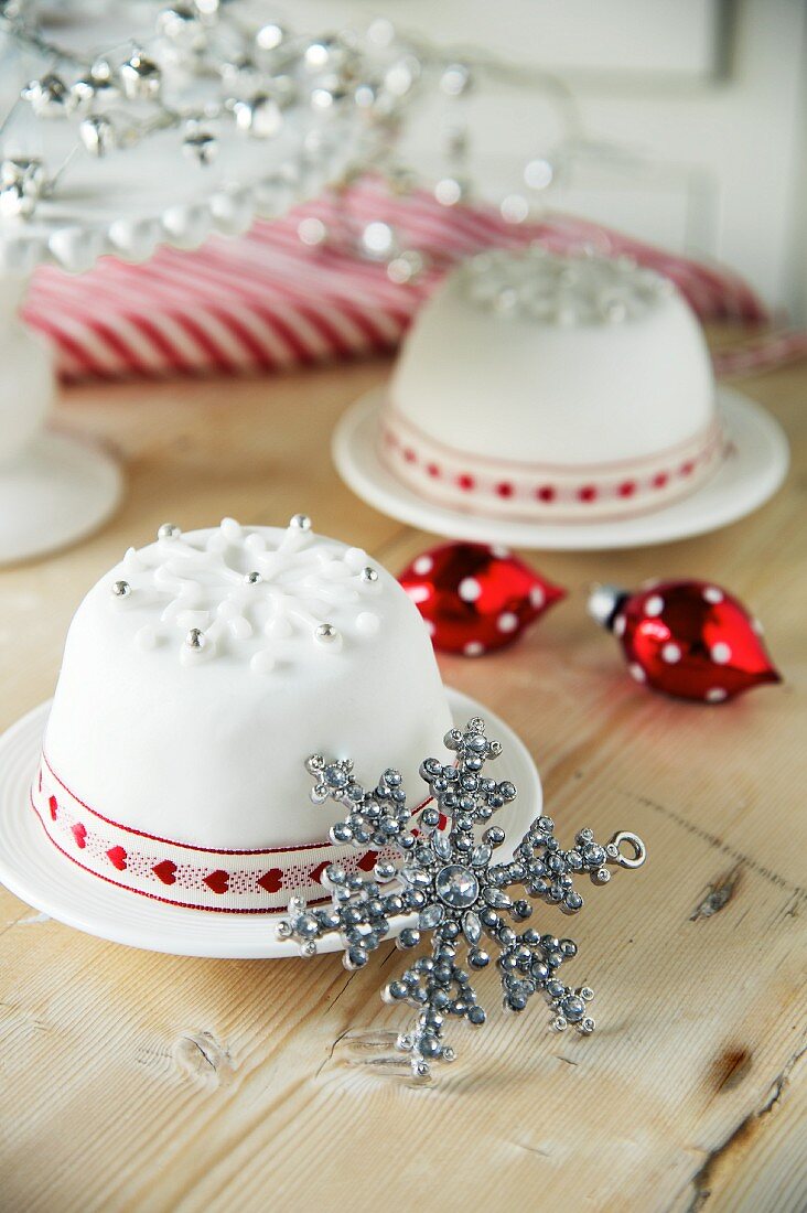 Christmas puddings covered in white icing