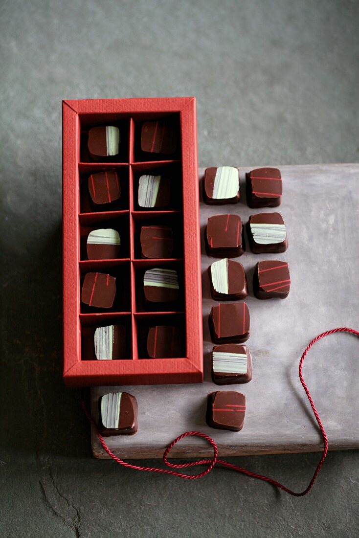 Chocolates filled with rosemary and pine nuts and with raspberry and Verveine