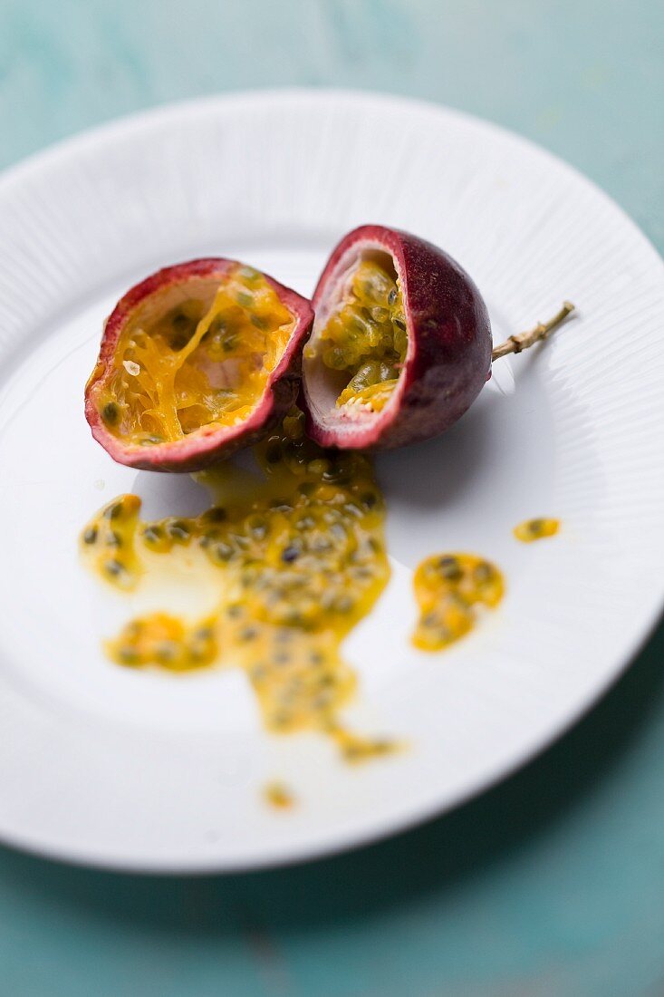 Hollowed-out passion fruit halves with passion fruit flesh