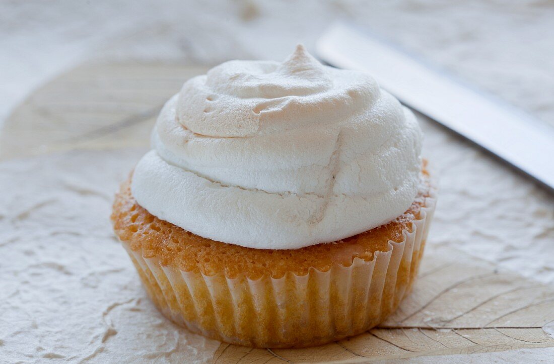 A muffin with a meringue top