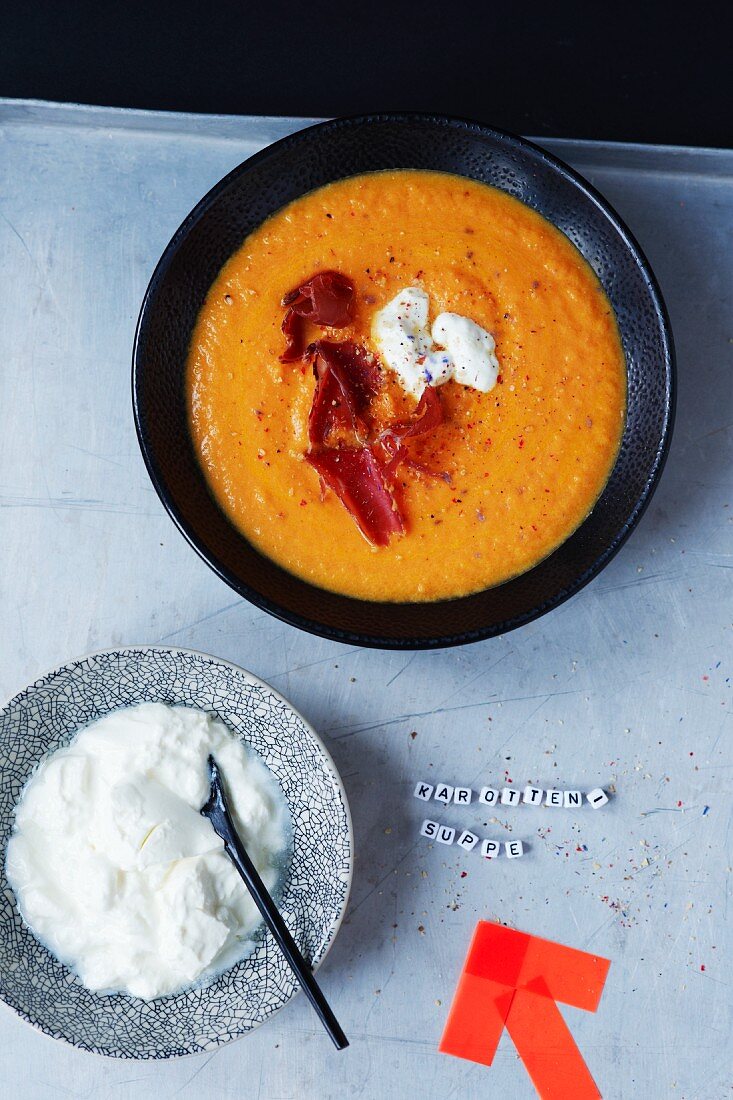 Carrot soup with bresaola and sour cream