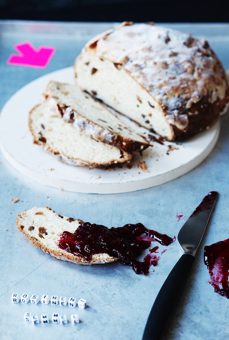 Partly sliced raisin bread