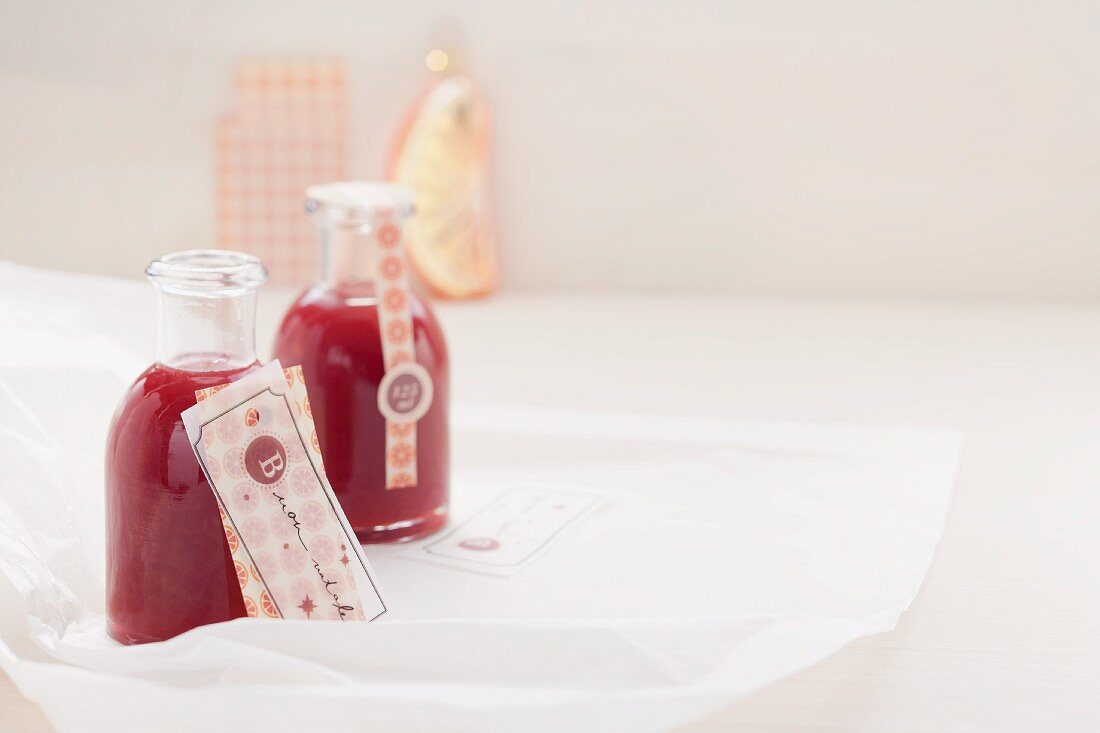 Small bottles of blood orange syrup with Campari