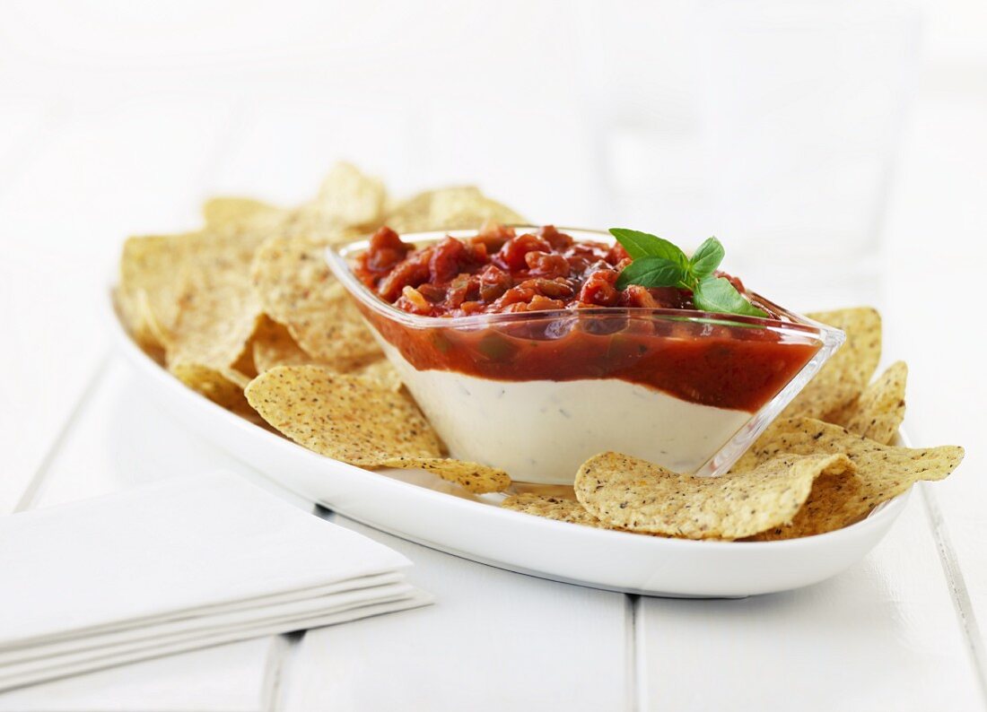 Tomato salsa and yoghurt dip with multi-grain tortilla chips